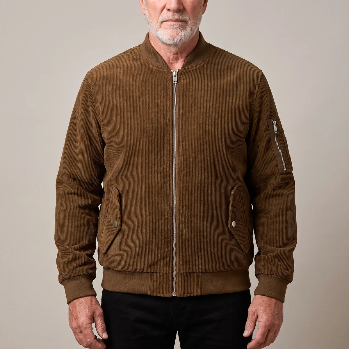 Men's brown corduroy bomber jacket with ribbed collar and snap-flap pockets, worn zipped
