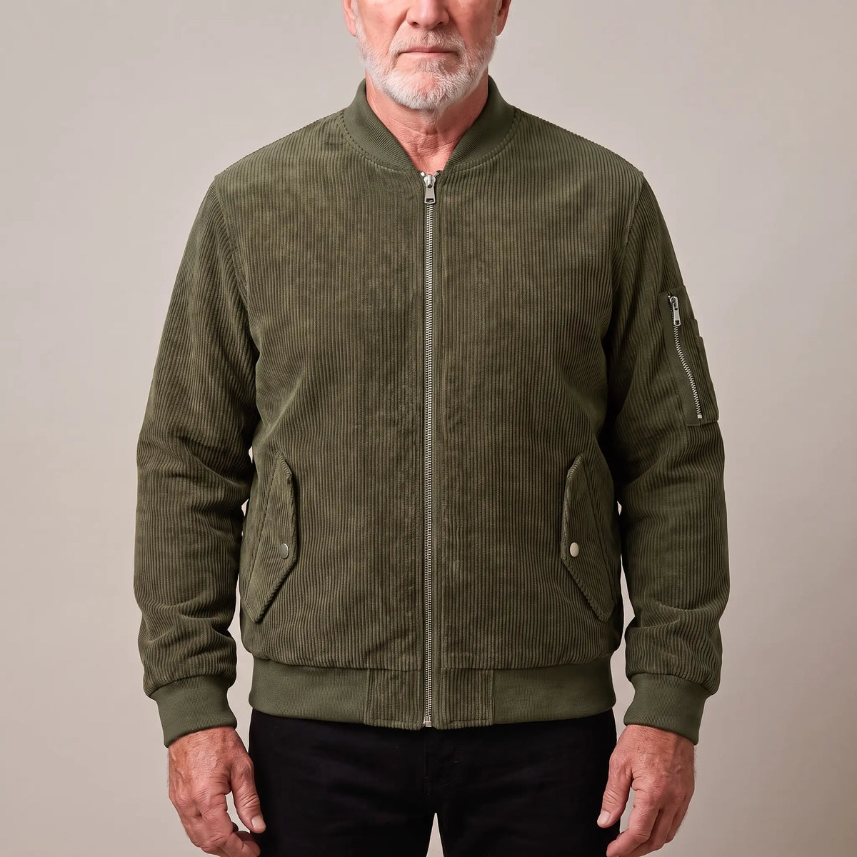 Men's green corduroy bomber jacket with ribbed collar and snap-flap pockets, worn zipped