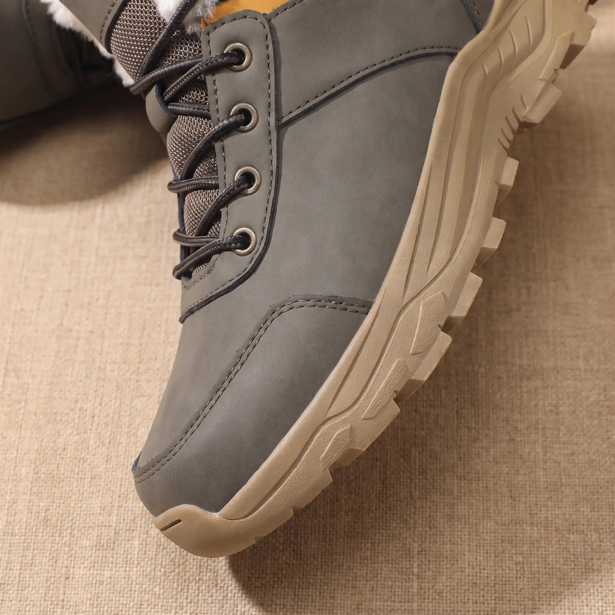 Snow Trail Boots in Grey, front half close-up showing the laces and chunky lug sole
