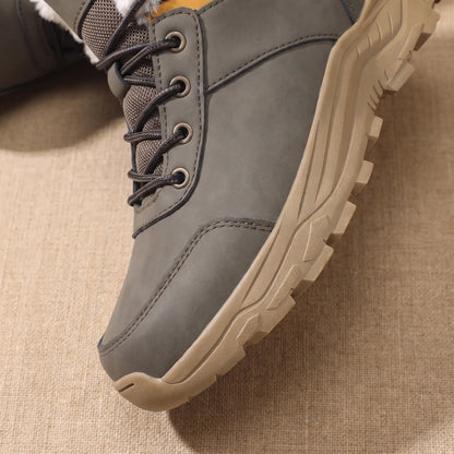 Snow Trail Boots in Grey, front half close-up showing the laces and chunky lug sole