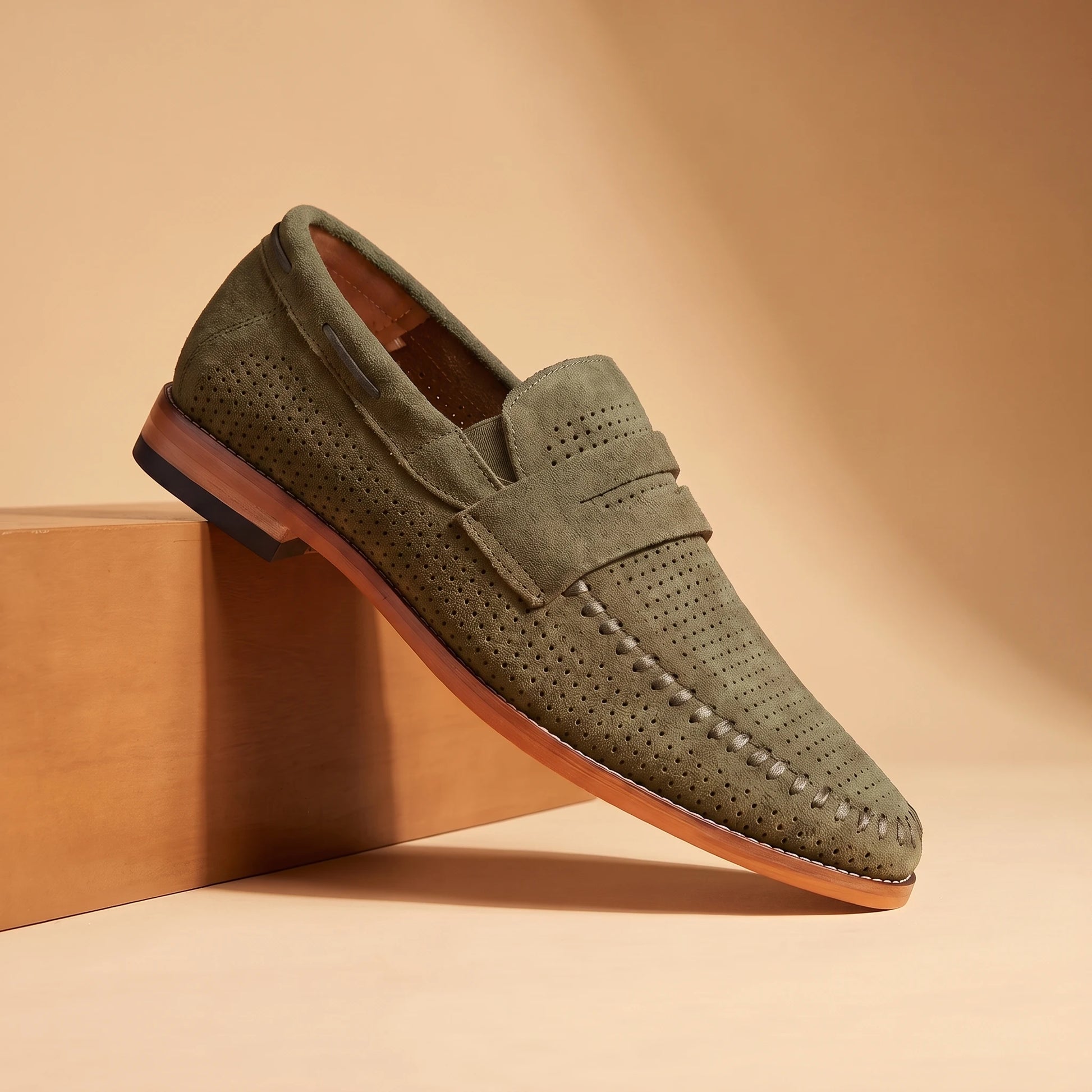 SOFT MOC LOAFERS in green, perforated suede penny loafer, pedestal hero