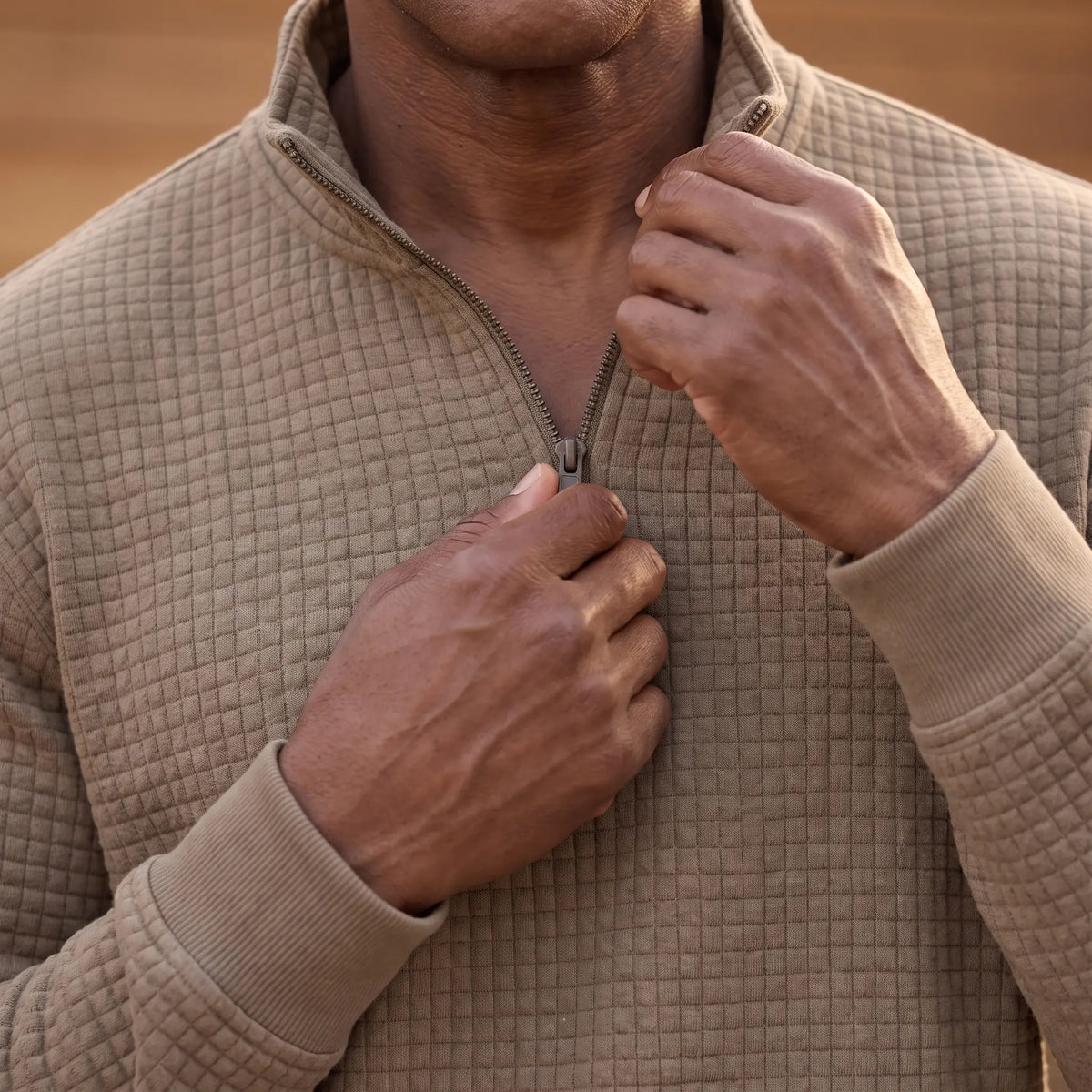 Man drawing up the quarter zip on the SOFT WAFFLE PULLOVER