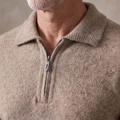 Close up of the spread collar and metal quarter-zip on the fuzzy knit sweater