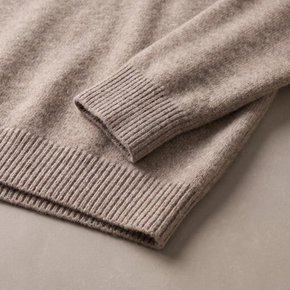 Ribbed cuff and ribbed hem of the fuzzy knit sweater laid flat