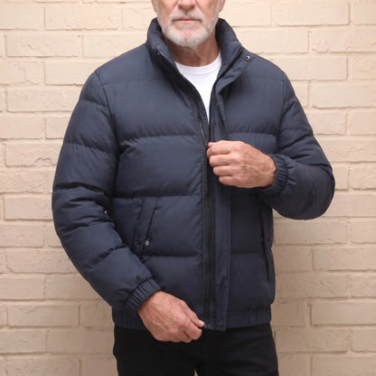 Stand Collar Puffer in Navy Blue, worn over a white tee