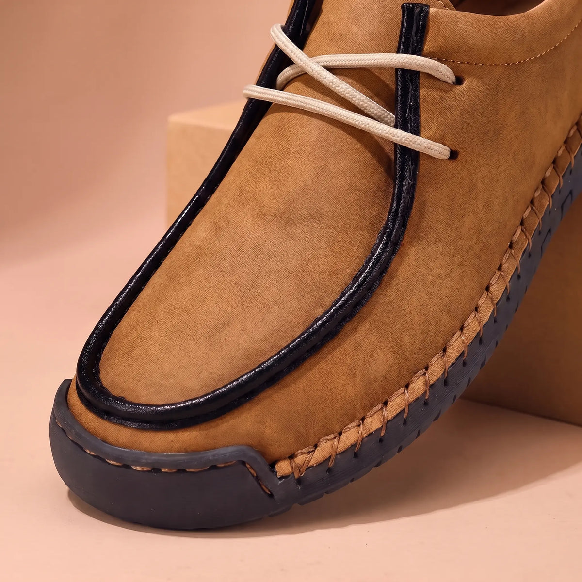 Moc toe and lacing detail of the brown shoe