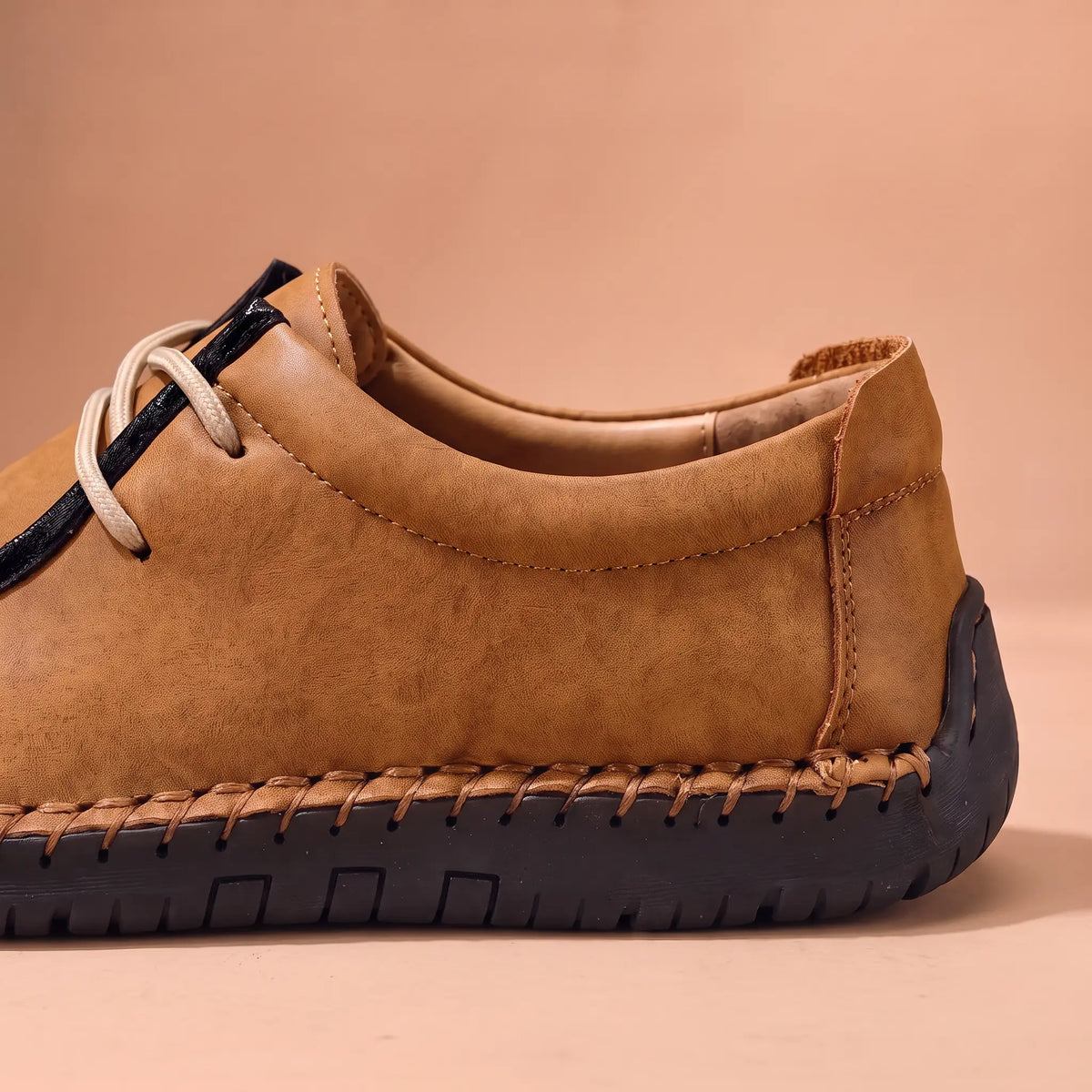 Heel and hand-stitched sole detail