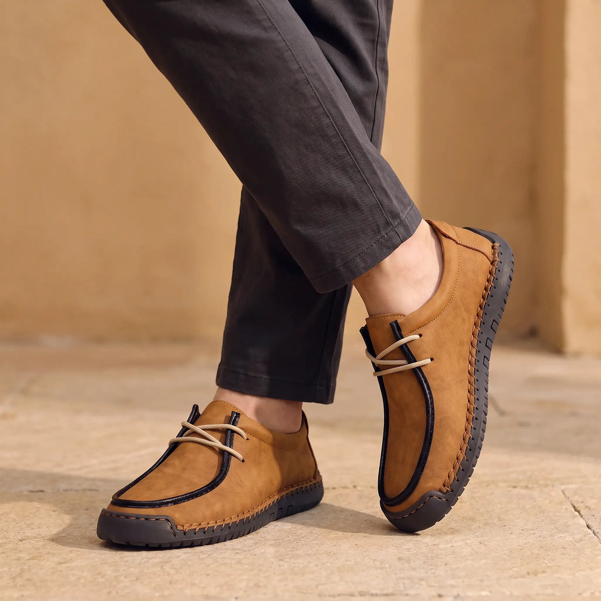 Man wearing brown stitched lace-up moc shoes