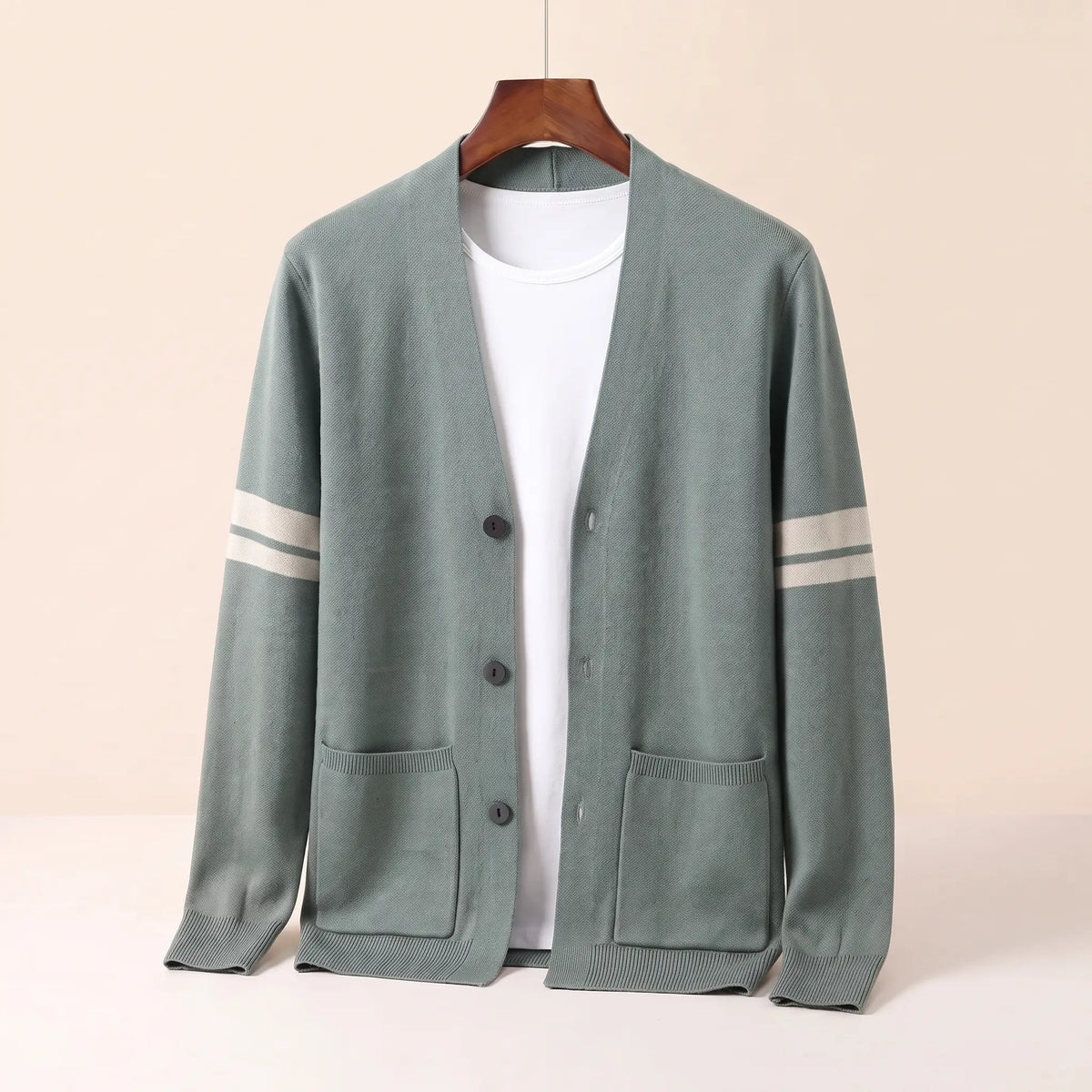 Men's green striped V-neck knit cardigan with three buttons, patch pockets and cream sleeve stripes