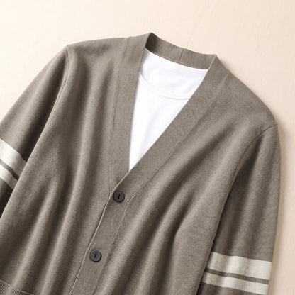 Close-up of men's khaki V-neck knit cardigan neckline and buttons