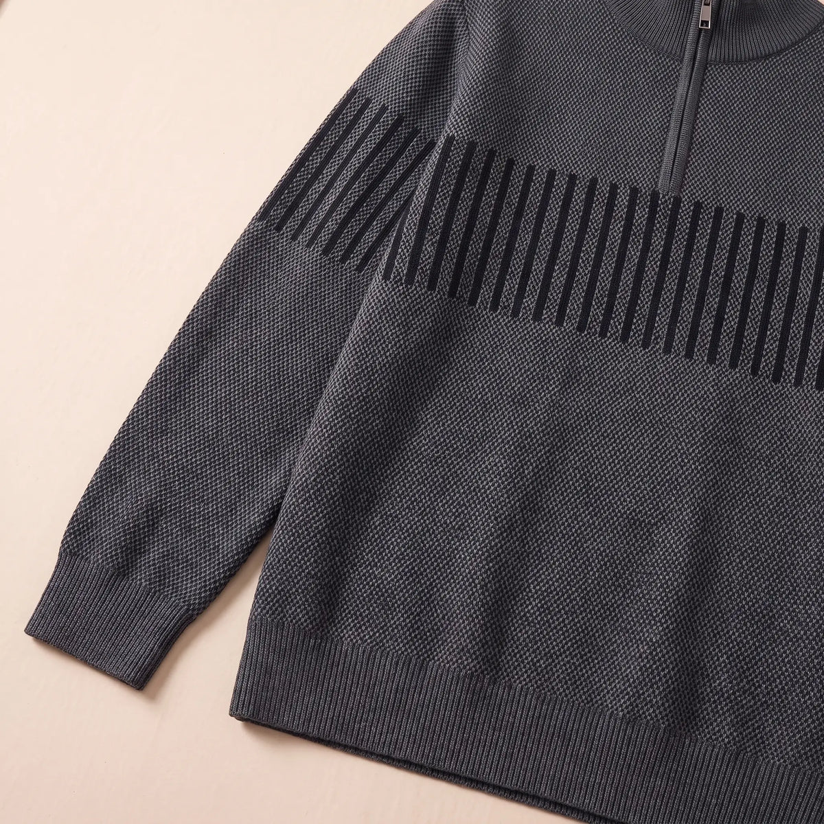 Close up of the STRIPE BAND SWEATER striped sleeve band, ribbed cuff and hem