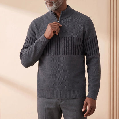 Man zipping up the STRIPE BAND SWEATER in dark gray