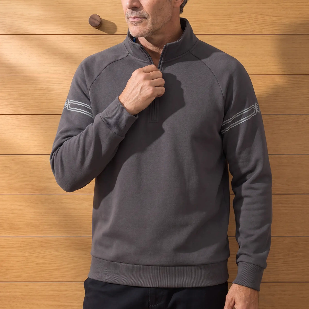 Stripe Sleeve Sweatshirt in Dark Grey worn with dark trousers