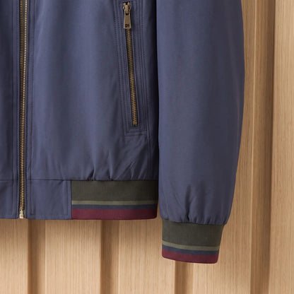Stripe Trim Jacket in Navy Blue, zip pocket and striped rib cuff close-up