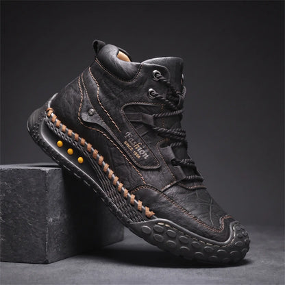 STUDDED SOLE BOOTS in black, men's mid-high lace-up boot in washed creased leather with hand-stitched sole edge and studded rubber outsole