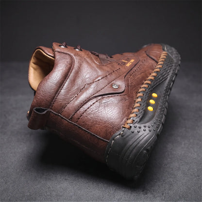 Close detail of STUDDED SOLE BOOTS showing the padded ankle collar and heel pull loop