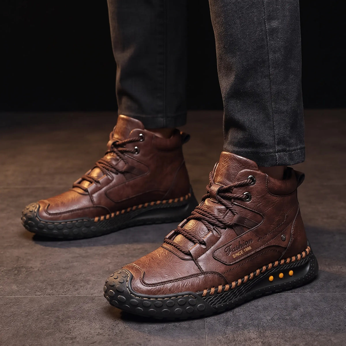 Man wearing STUDDED SOLE BOOTS in brown with dark trousers