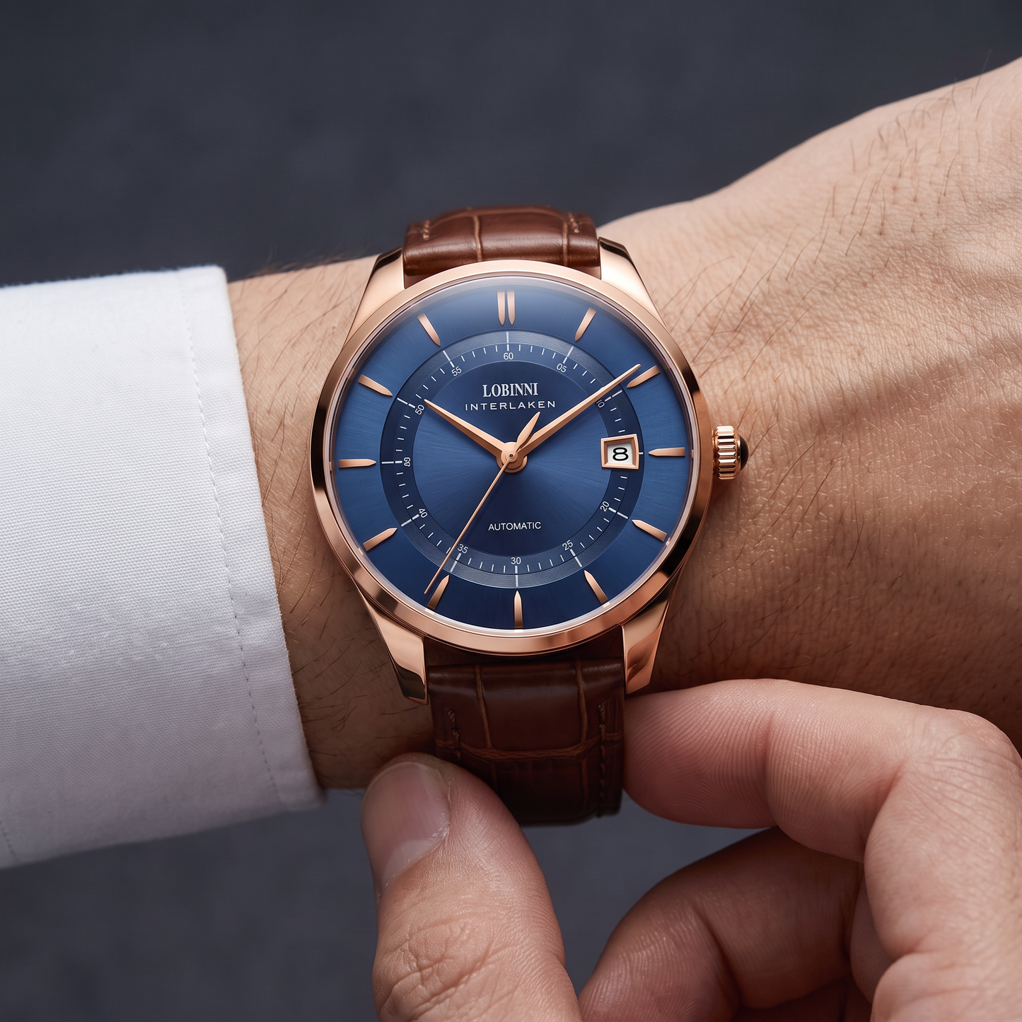 Man fastening the leather strap buckle of the automatic watch on his wrist