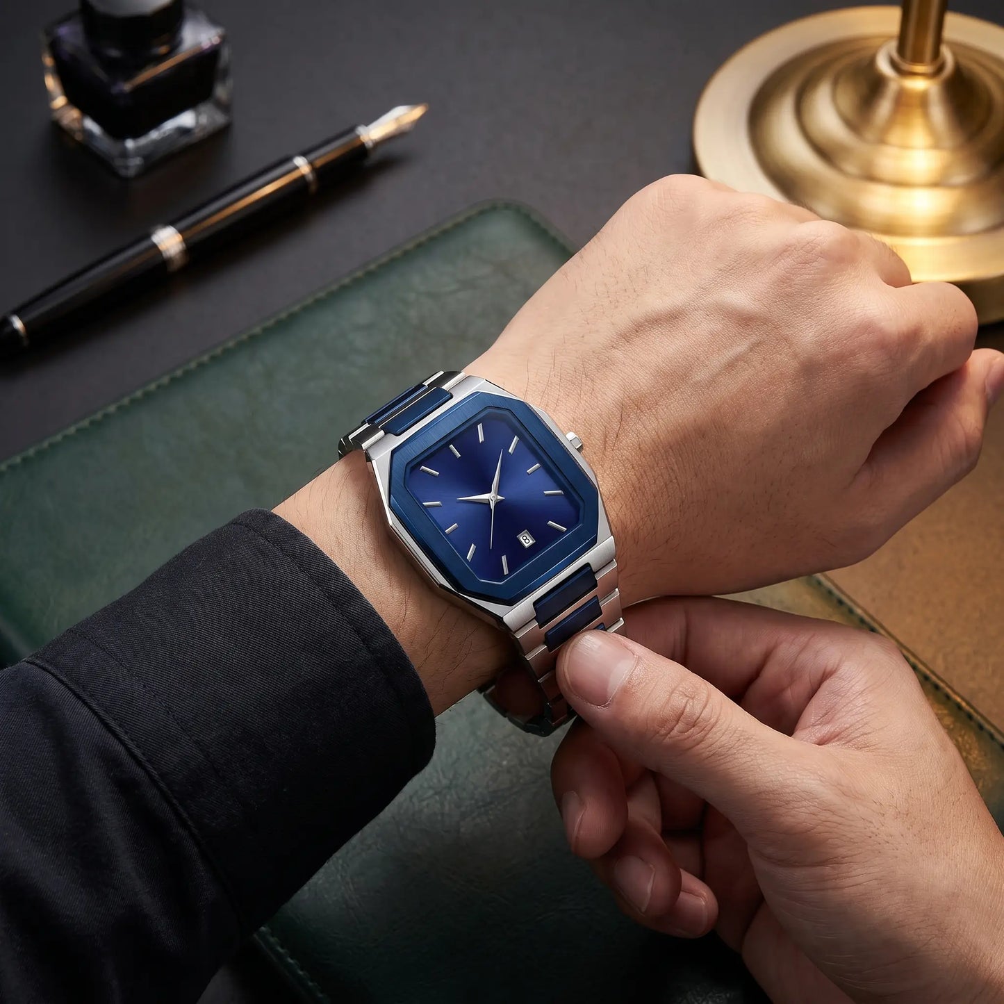 SUNBURST DIAL WATCH worn on the wrist - fastening the two-tone steel bracelet clasp