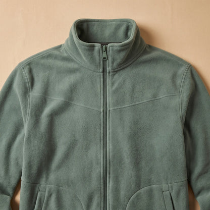 Close detail of TALL COLLAR FLEECE showing the tall stand collar and full-length zip
