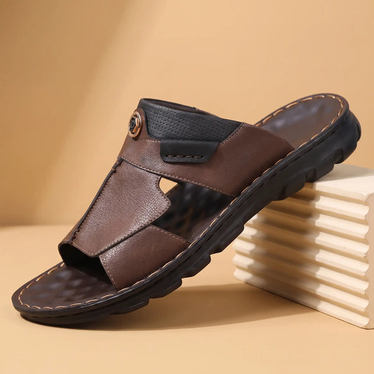 Brown mens open toe slide with stitched leather panels metal emblem tab and lugged sole