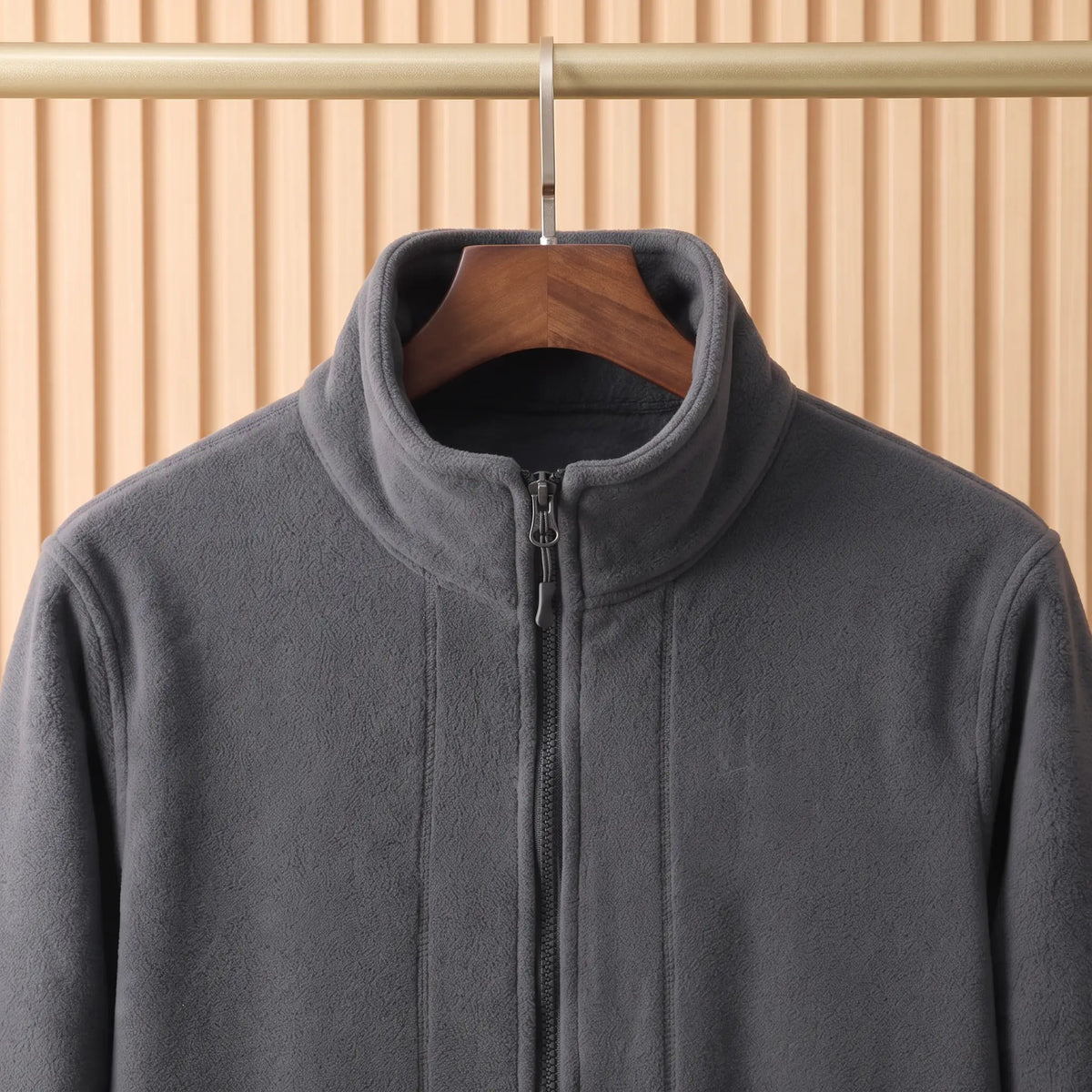 THICK POLAR FLEECE collar close-up - tall stand collar and full-length zip on the grey polar fleece jacket