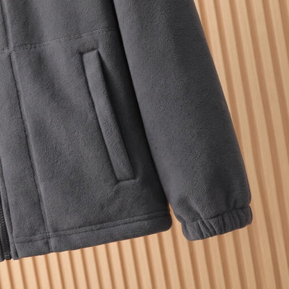 THICK POLAR FLEECE cuff and hem close-up - elasticated cuff, slanted welt pocket and straight hem on the grey jacket