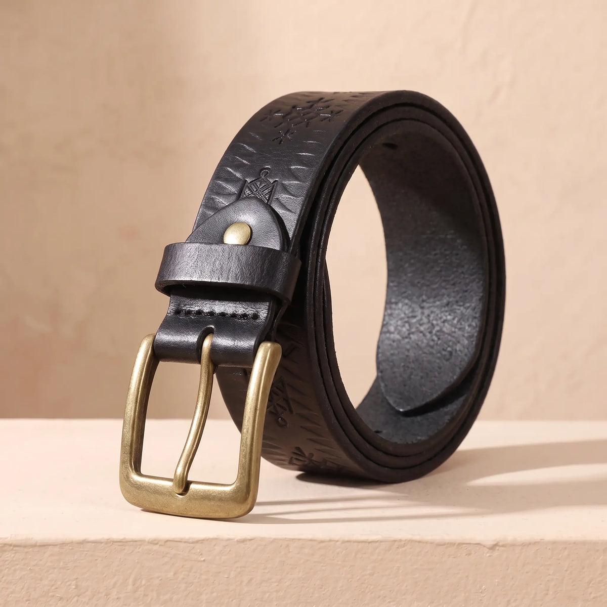THICK STAMPED BELT in black, real cowhide belt with pressed tribal pattern and antique brass buckle
