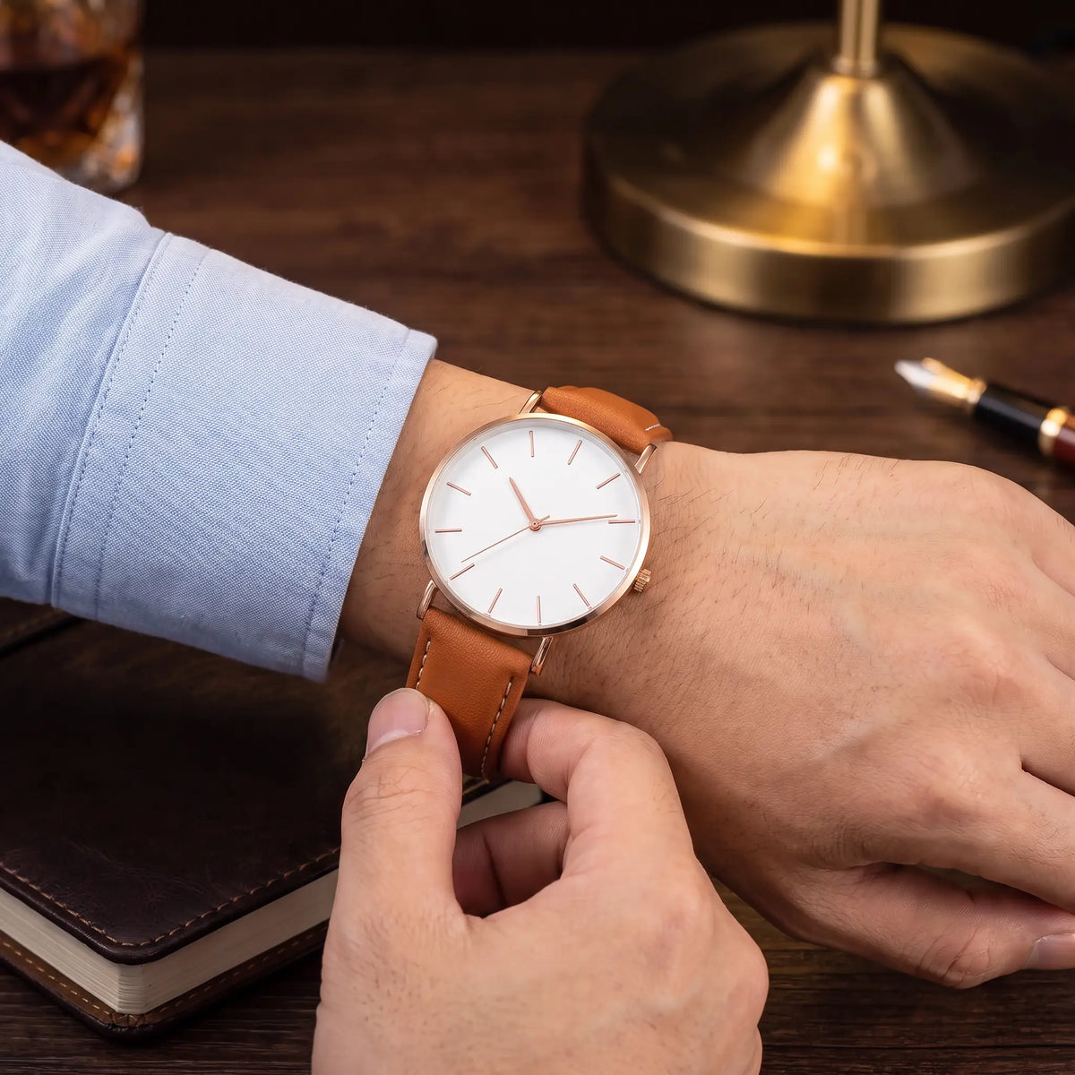 Thin Case Watch in Brown White, being fastened on the wrist