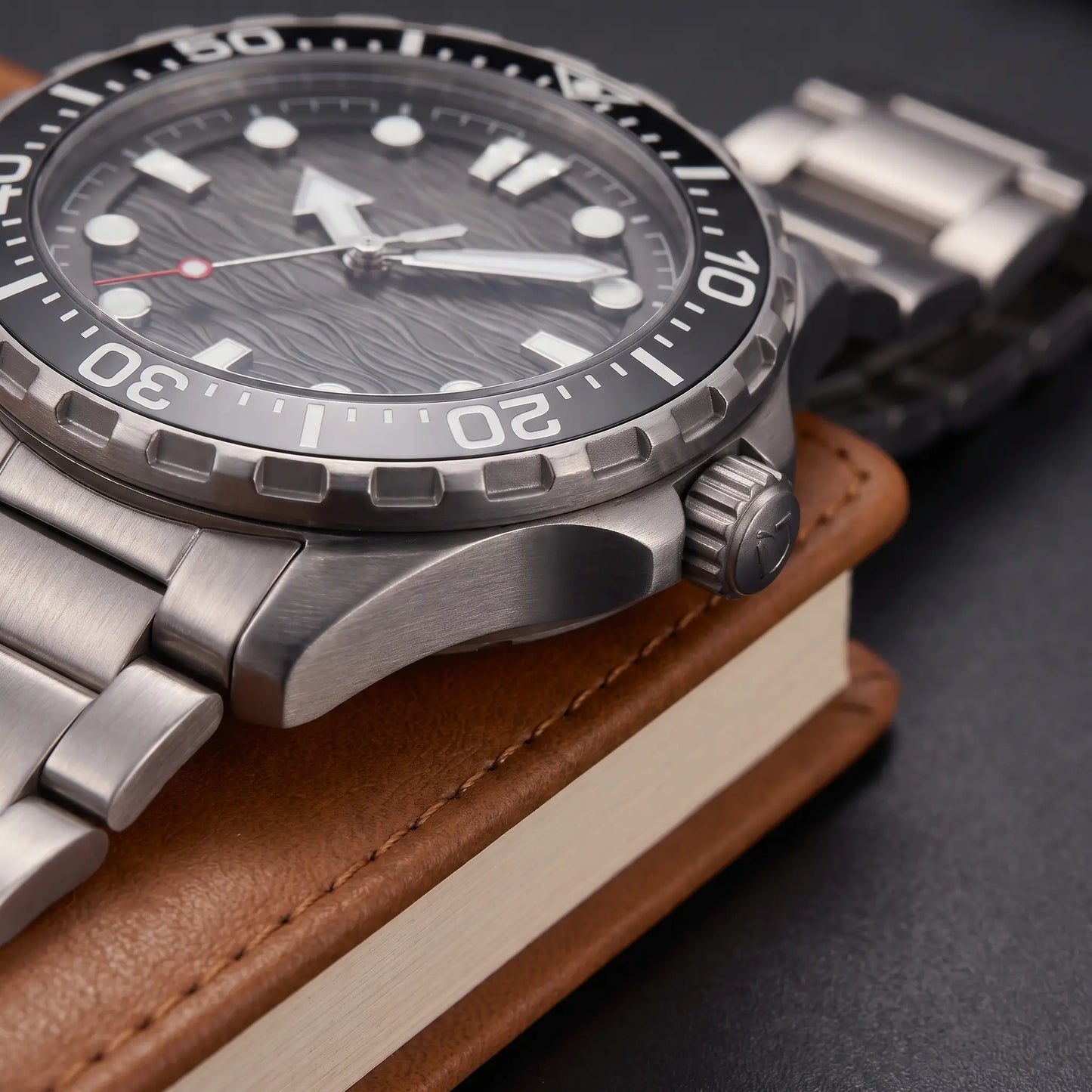 TITANIUM DIVE WATCH case close-up - screw-down crown, crown guards and brushed titanium bracelet