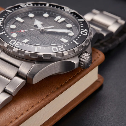 TITANIUM DIVE WATCH case close-up - screw-down crown, crown guards and brushed titanium bracelet