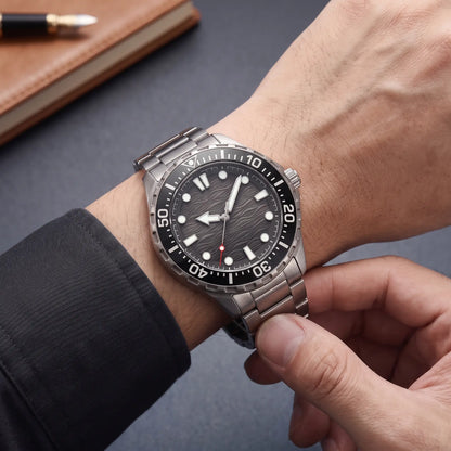 TITANIUM DIVE WATCH worn on the wrist - fastening the titanium bracelet of the black dial dive watch