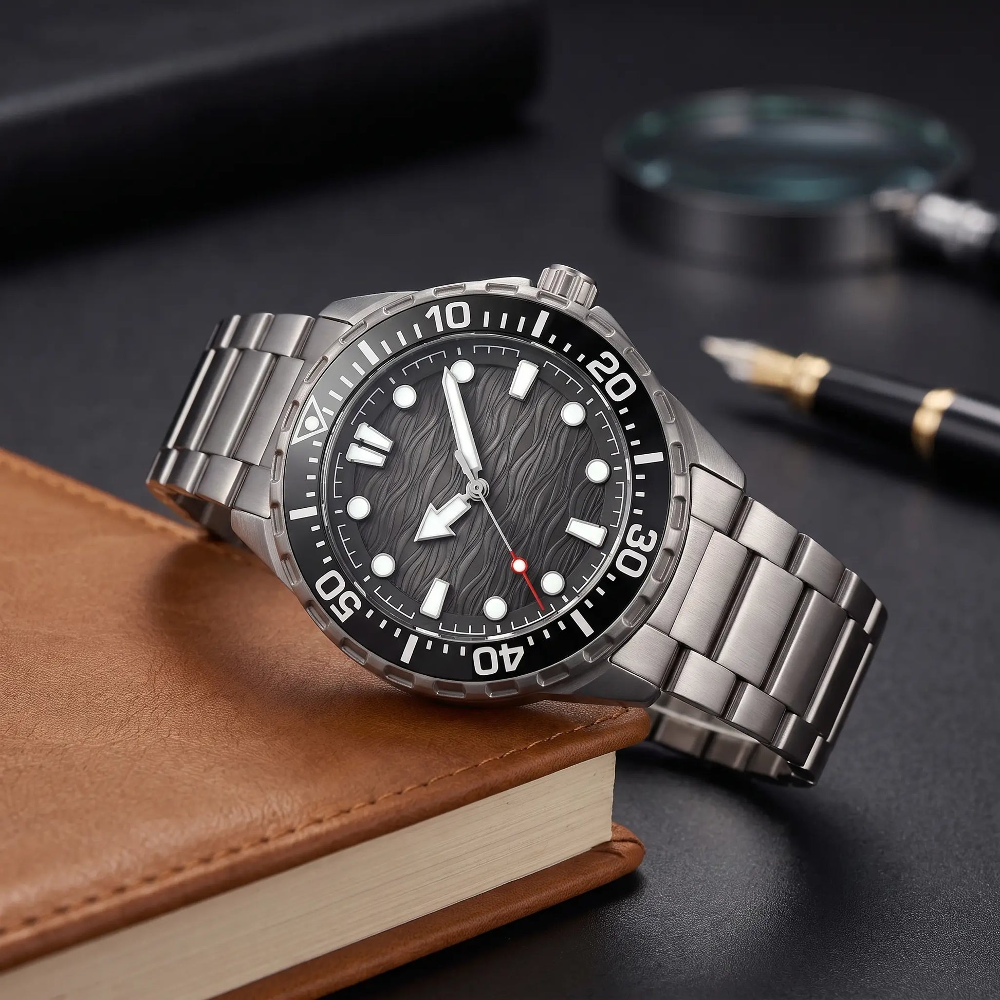 TITANIUM DIVE WATCH in Titanium Black - dive watch with black wave dial and rotating bezel on a leather journal