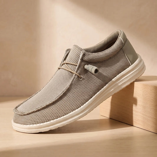Toggle lace moccasins in khaki knit on a pale oak block