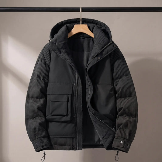 Trailhead utility puffer in black on a wooden hanger