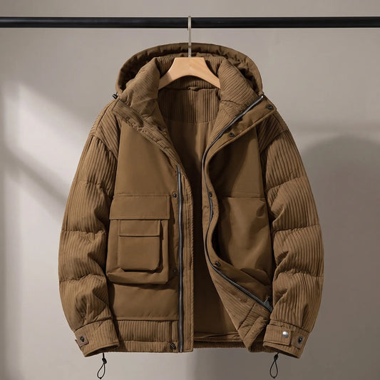 Trailhead utility puffer in brown on a wooden hanger
