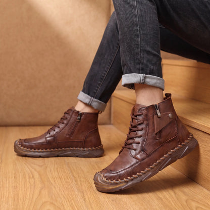Man wearing brown stitched ankle boots