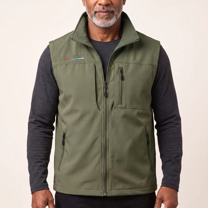 Man wearing the army green zip-front outdoor vest over a charcoal long-sleeve top
