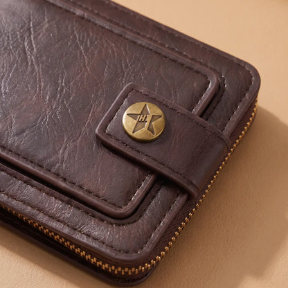 Close-up of trifold wallet snap tab, bronze button and zip