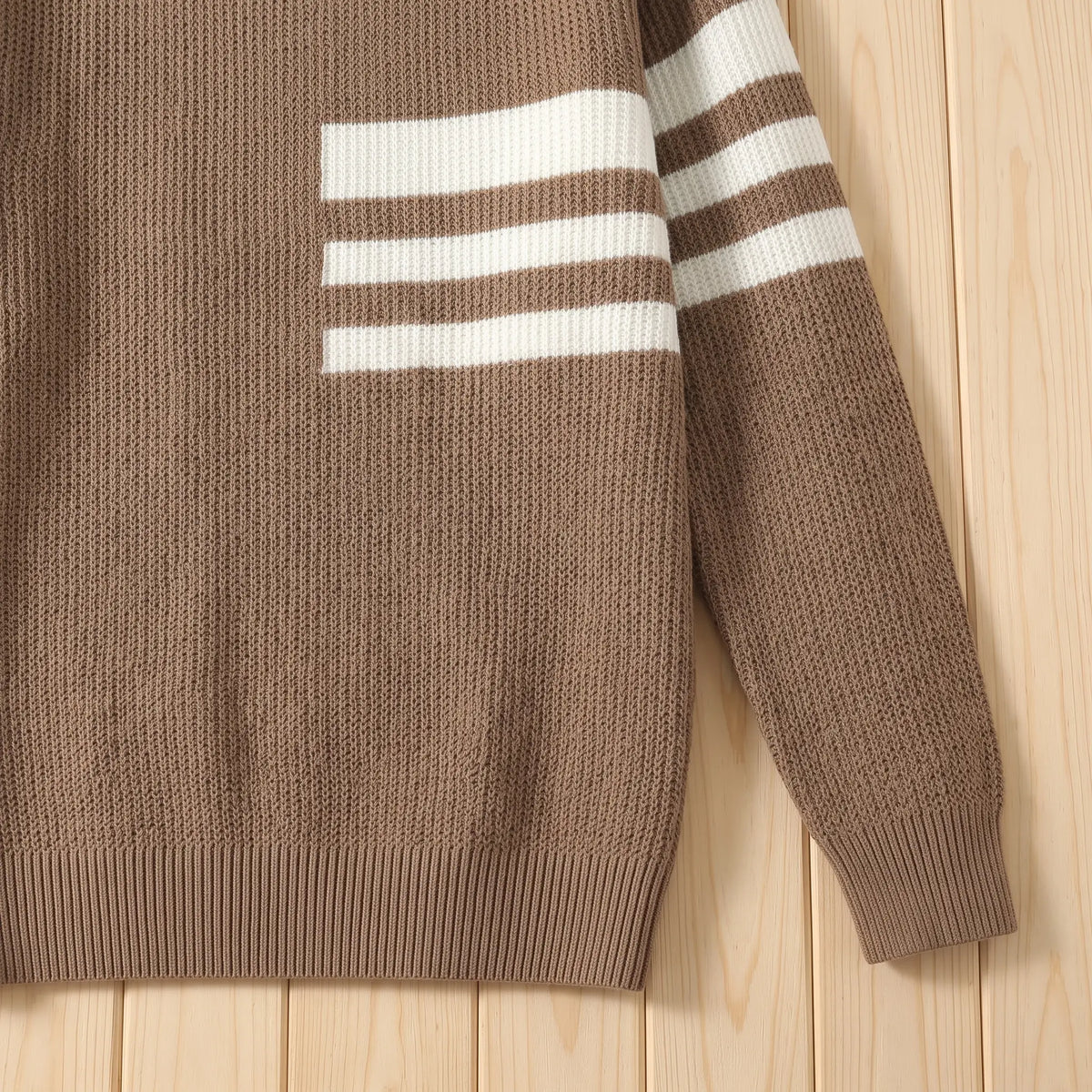 Close up of the TRIPLE STRIPE SWEATER striped sleeve, ribbed cuff and hem