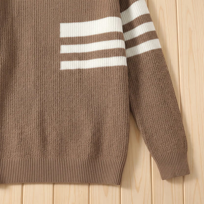 Close up of the TRIPLE STRIPE SWEATER striped sleeve, ribbed cuff and hem
