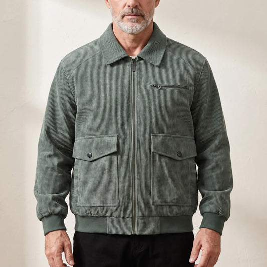 Men's green corduroy zip jacket with shirt collar and snap-flap pockets, worn zipped
