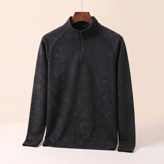 Men's black vintage wash quarter-zip top with stand collar and raglan sleeves on a wooden hanger