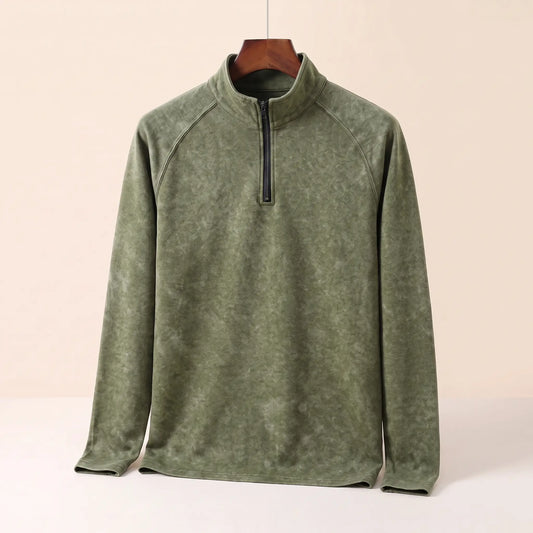 Men's green vintage wash quarter-zip top with stand collar and raglan sleeves on a wooden hanger