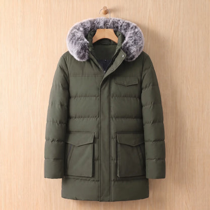 Green warm longline parka for men with fur trimmed hood on a wooden hanger