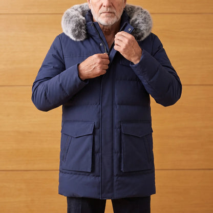 Man zipping up a navy blue warm longline parka with fur trimmed hood