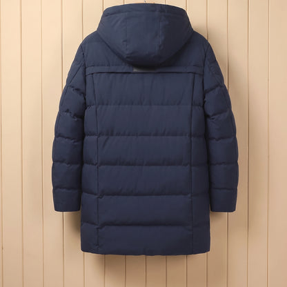 Back view of navy quilted winter coat with hood on a wooden hanger