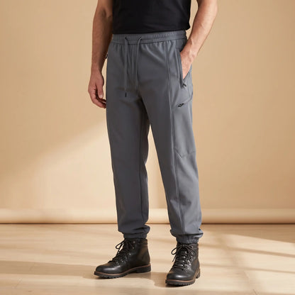 WARM TRAIL JOGGERS in gray, men's fleece-lined softshell joggers with zip pockets and cuffed hems