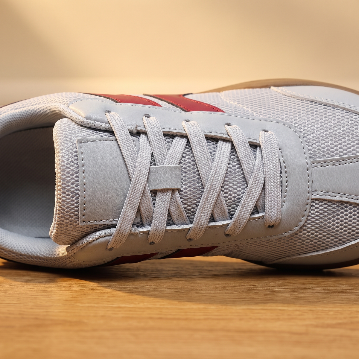 Close-up detail of the Wide Toe Trail Sneakers lacing, eyelets and padded tongue