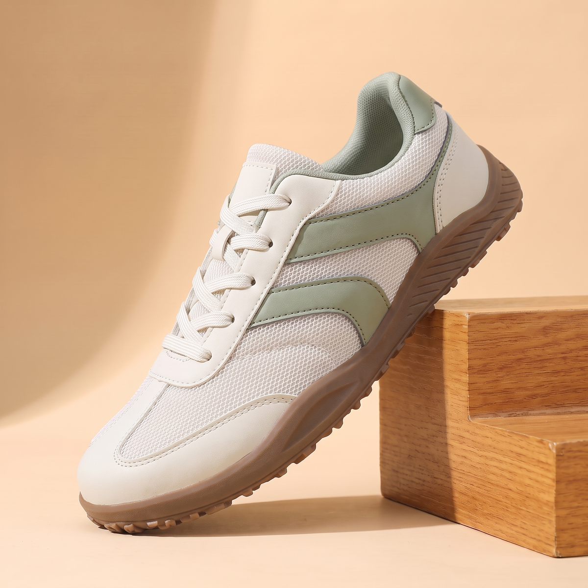 Wide Toe Trail Sneakers in cream with sage green side stripes and gum sole